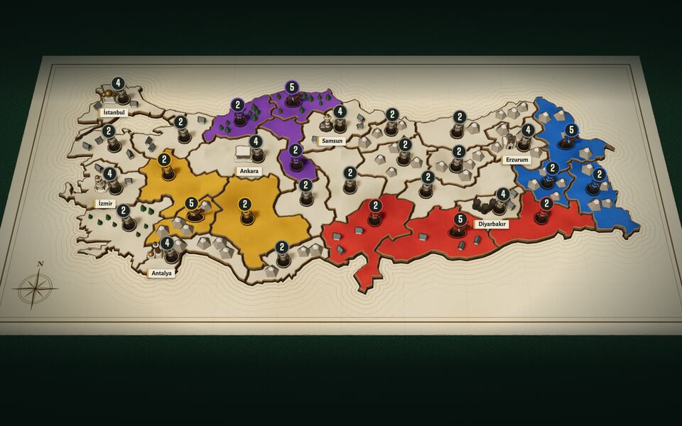 The Türkiye board: a paper map lying on a dark table, its provinces in four players' colours with playing pieces standing on them.